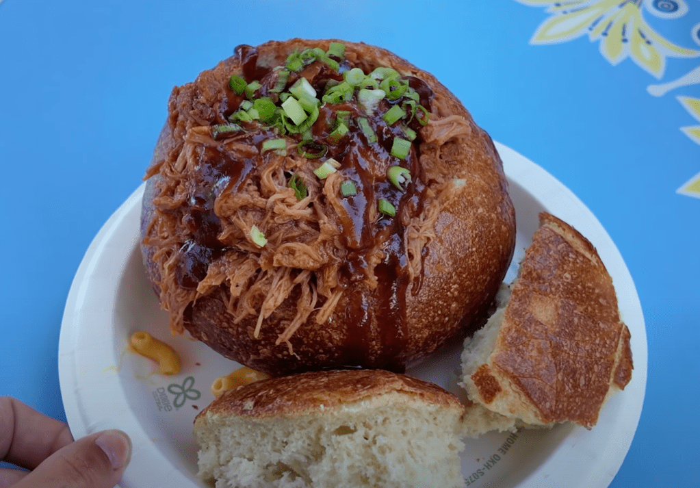 Disneyland 70th Anniversary Food, Disneyland Snacks, 70th Celebration Snacks, Disneyland Food Review, Disneyland 70th Anniversary Treats, Café Daisy Chicken Bacon Ranch Flop-Over, 70th Celebration Churro, Jolly Holiday Bakery Café Celebration Matterhorn Macaroon, Market House Mickey Hat Cookie, Red Rose Tavern 70th Stuff, 70th Celebration Macaron, Refreshment Corner Pulled Pork Mac and Cheese in a Bread Bowl, Tiana’s Palace House-filled Celebration Beignet, Troubadour Tavern W.E.D. Chili Cheese Baked Potato, Troubadour Tavern Chicken Pot Pie Baked Potato, Troubadour Tavern Tiramisu Cold Brew, Hollywood Lounge Celebration Cocktail, Hollywood Lounge Pink Dragon Fruit Mimosa, Schmoozies Mickey-shaped Celebration Waffles, Disneyland Celebration Snacks 2023, Disneyland Food Guide, Disneyland Special Drinks, Disneyland Bakery Items, Disneyland Menu Highlights, Disneyland Sweet Treats, Disneyland Savory Snacks, Disneyland Party Foods, Disneyland Anniversary Eats